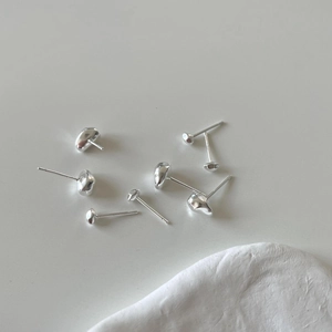 Minimalist 925 sterling silver bean stud earrings set on a clean white background