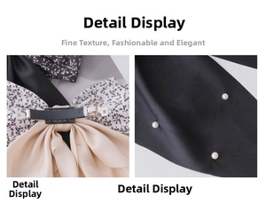 Detailed macro view of the metal spring clip and floral fabric texture on the hair bow