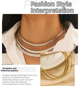 Close-up of triple-layered 18k gold plated herringbone chain with polished mirror finish