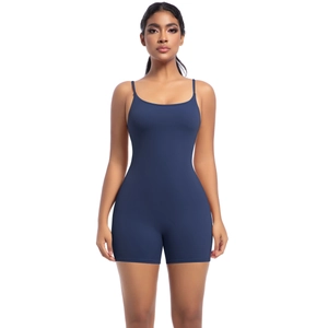 Close-up of seamless navy blue yoga jumpsuit with thin straps and slimming elastic fabric