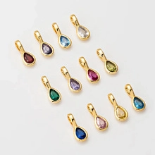 Grid view of teardrop gemstone pendants in twelve vibrant colors with gold metal plating