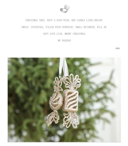 Close-up of sparkling champagne gold candy Christmas tree ornaments with ribbon ties