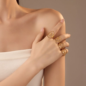 Gold-plated ocean theme adjustable ring set with starfish, seashell and leaf designs