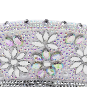 Macro view of crystal rhinestones and colorful gem flower pattern on a white party hat