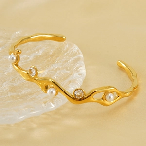 Bracciale rigido vintage placcato oro 18k con perle e zirconi su vetro strutturato