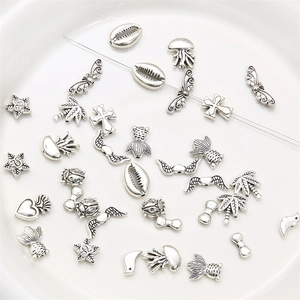 Silver alloy charms set featuring star, shell, and heart shapes for DIY jewelry making