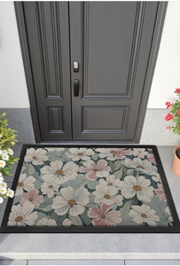 Detailed close-up of a non-slip floral entryway mat featuring pink flowers and dark edges