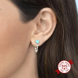 925 silver heart stud earrings with blue enamel and sparkling tassel drop on a model