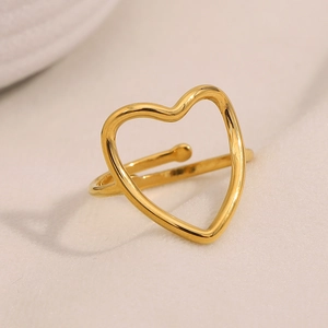Macro shot of 18K gold-plated stainless steel hollow heart ring with adjustable band