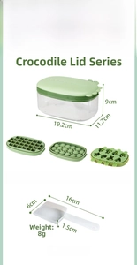 Detail view of crocodile-themed ice cube tray set dimensions including box and scoop
