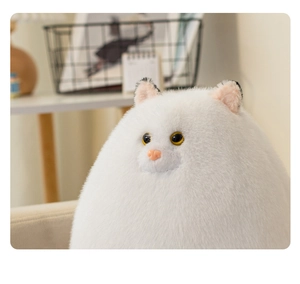 Detailed close-up of fluffy white Persian cat plush with realistic long fur and yellow eyes