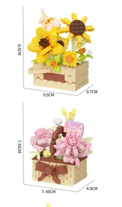 Detailed view of artificial block flower pots featuring sunflower and dahlia designs