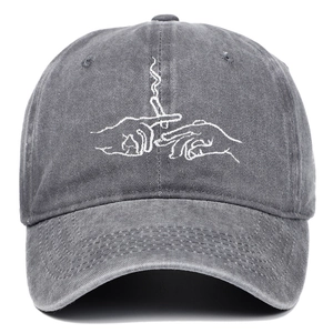 Detailed close-up of vintage charcoal grey washed cotton baseball cap with white embroidery