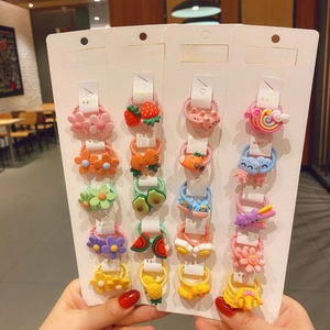 Detail of 10-piece cartoon hair ties featuring fruit and flower resin charms for girls