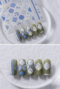 Detailed 5D embossed nail stickers featuring blue and yellow floral and geometric patterns