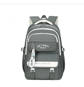 Front detail of gray-green backpack with multi-layer zipper pockets and white strap décor