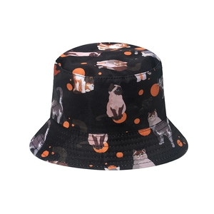 Black bucket hat with cute cat prints and orange polka dots for sun protection