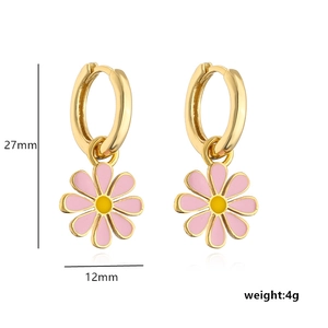 Detail of gold daisy drop earrings with pink enamel petals and 27mm height measurements