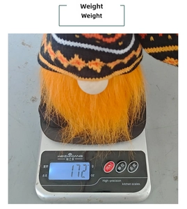 Weight measurement of Halloween gnome doll showing approximately 172g on a digital scale