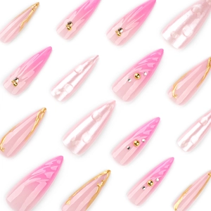 Pink 3D shell press on nails with stiletto shape, gold foil, and elegant pearl accents