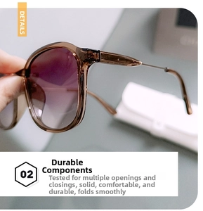 Detail view of durable metal hinges and gradient lenses on oversized sunglasses