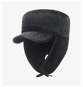 Detailed view of the thick black faux fur texture and ear protection of the winter cap