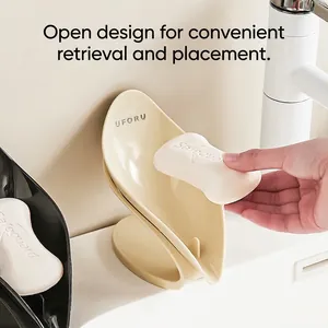 Leaf-shaped draining soap dish with inclined vertical design for bathroom sink
