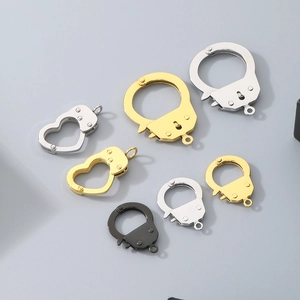 Macro detail of heart and round metal handcuff clasps for DIY jewelry in various colors