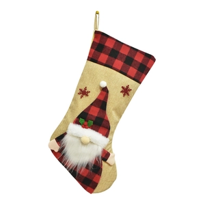 Detail of Christmas stocking featuring 3D Santa Claus and red-black buffalo plaid accents