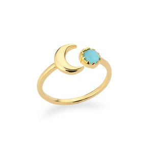Detail of gold crescent moon and blue gemstone on a minimalist adjustable ring