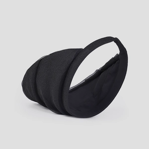 Detail of black organza sun hat with pleated pearlescent fabric and wide brim design