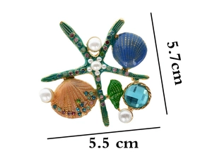 Detail showing colorful enamel starfish and shell brooch with dimensions 5.7cm by 5.5cm