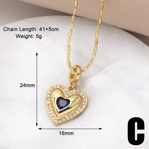Detailed view of gold heart necklace with blue gemstone and size dimensions shown