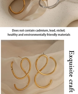 Detailed view of irregular golden spiral earrings made of eco-friendly stainless steel