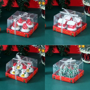 Christmas candle set with snowman, tree and house designs in festive gift packaging