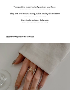 Macro detail of adjustable butterfly ring featuring pavé-set zircons on gold wings