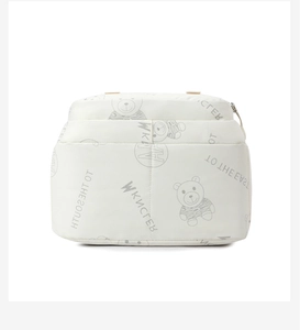 Detail of white storage bag with cartoon bear prints and high-quality fabric texture