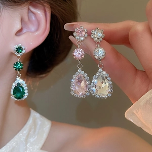 Detailed close-up of water drop rhinestone tassel earrings in green pink and white