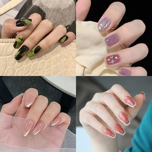 Collage of four trendy press-on nail styles including marble, glitter, and french tips