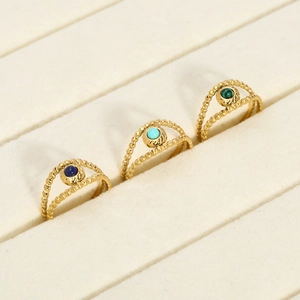 Detail of 18K gold beaded rings with lapis, turquoise, and malachite stones