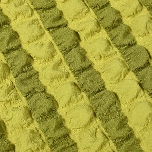 Detailopname van de popcorn-textuur van de stof met limoen en olijfgroene strepen
