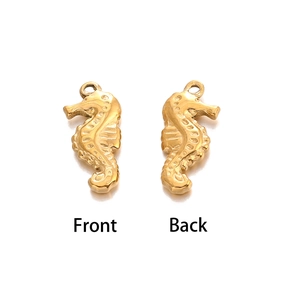 Front and back detail of golden seahorse metal charms with 3D embossed texture
