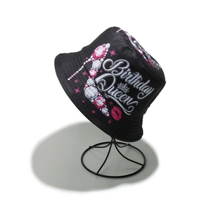 Detail of Birthday Queen print with crown and jewels on black bucket hat for women