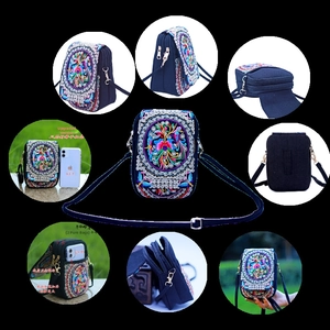 Ethnic embroidery phone bag featuring three zipper pockets for a 6.1-inch smartphone