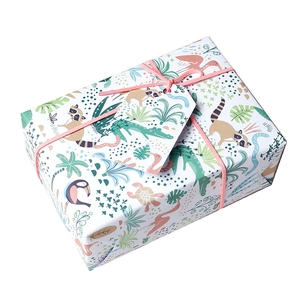 White gift box with jungle animal patterns, pink ribbon bow and matching tag