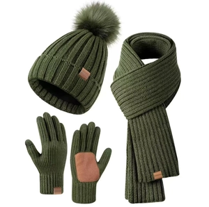 Flat lay of dark green knit winter set with beanie hat, scarf, and touchscreen gloves