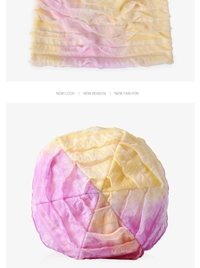 Dettaglio delle pieghe a strati sul cappello in cotone sfumato giallo e rosa