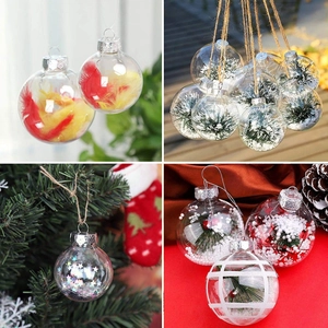 Detail view of transparent Christmas ornaments with feathers, stars, and snow fillings