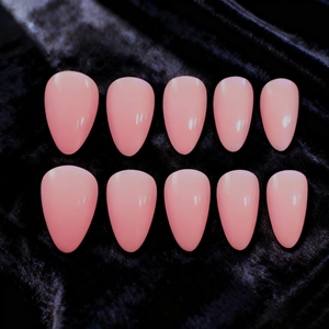 Glossy light pink almond press-on nails set of 10 pieces on elegant black velvet