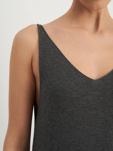 Close-up of dark grey knitted V-neck top with fine straps and delicate fabric texture